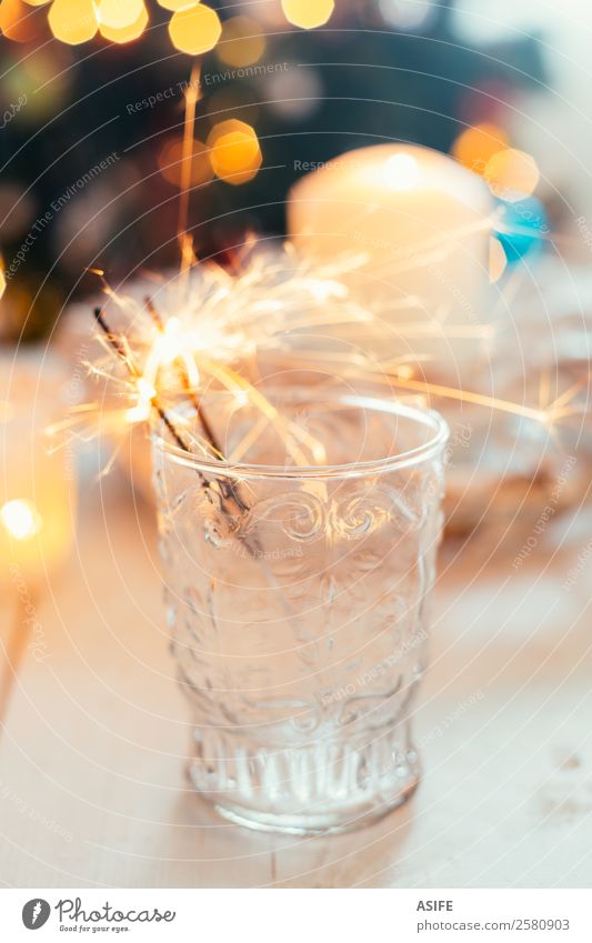 Sparklers in a glass Joy Decoration Feasts & Celebrations Christmas & Advent New Year's Eve Warmth Tree Candle Happiness White bokeh. table Ornaments lighting