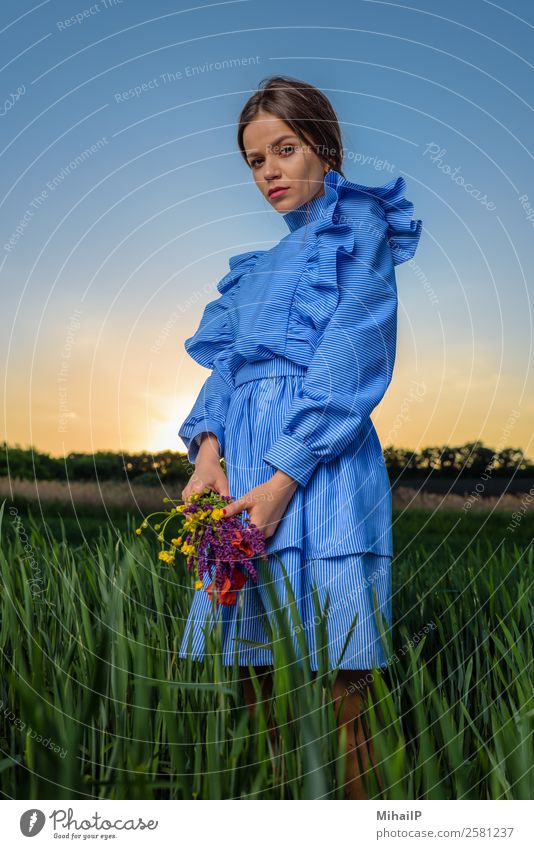Stinging resentment look. Human being Young man Youth (Young adults) Woman Adults Nature Plant Sky Flower Fashion Dress Bouquet Stripe Stand Blue Green Red girl