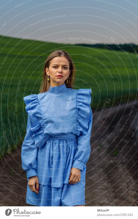 Standing on the country road. Human being Feminine Woman Adults Nature Plant Fashion Dress Earring Stripe Blue Green Red girl Caucasian Moldovan one Europe