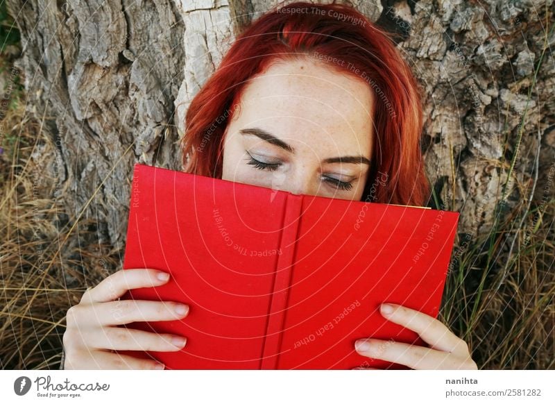 Young redhead woman covered by a book Lifestyle Style Design Freckles Leisure and hobbies Human being Feminine Young woman Youth (Young adults) Woman Adults 1