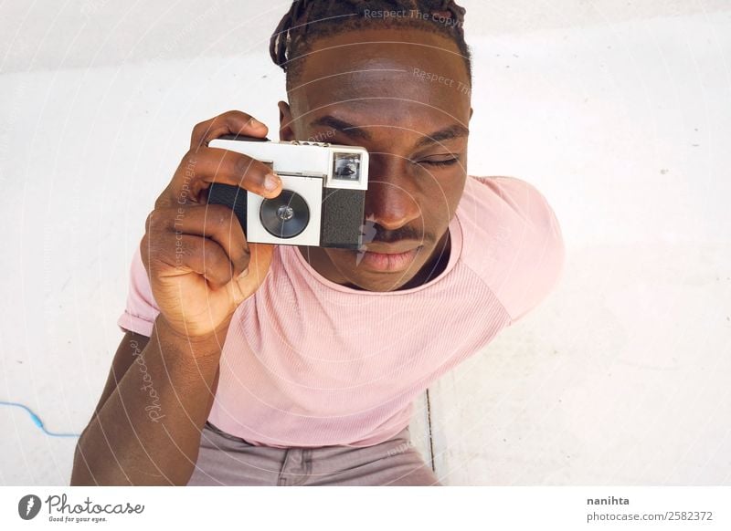 Young man taking a shot with an old camera Lifestyle Style Design Leisure and hobbies Camera Human being Masculine Youth (Young adults) Man Adults 1