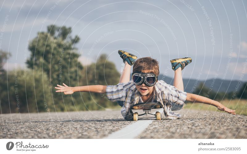 Happy little boy playing on the road Lifestyle Joy Playing Vacation & Travel Trip Adventure Freedom Camping Summer Sports Success Child Human being Boy (child)