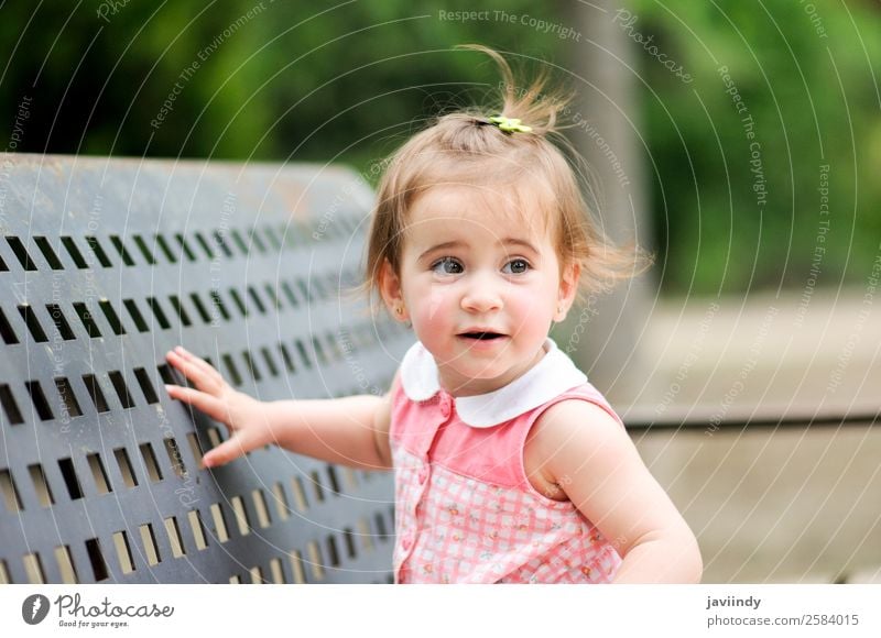 Adorable little girl playing in a urban park Lifestyle Joy Happy Beautiful Leisure and hobbies Playing Summer Child Human being Baby Toddler Girl Infancy 1