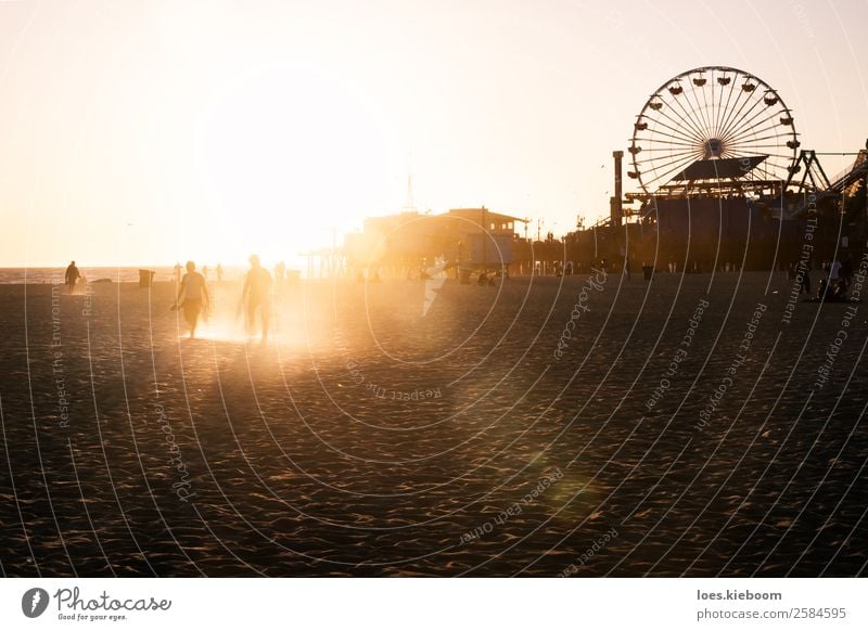 Silhouettes of people walking along Santa Monica pier Joy Vacation & Travel Summer Beach Human being 2 Nature Landscape Sand Sun Spring Ocean Manmade structures