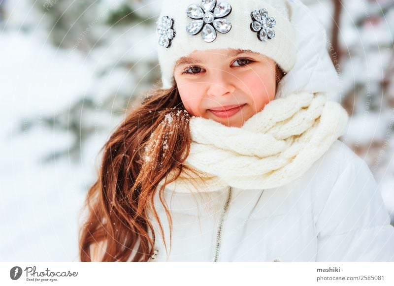 Winter close up portrait of cute dreamy child girl Joy Vacation & Travel Adventure Freedom Snow Child Infancy Nature Snowfall Warmth Tree Park Forest Clothing