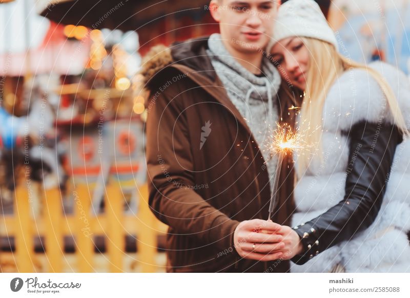 happy couple with christmas firelights walking in city Shopping Joy Happy Vacation & Travel Winter Decoration New Year's Eve Couple Street Fur coat Embrace