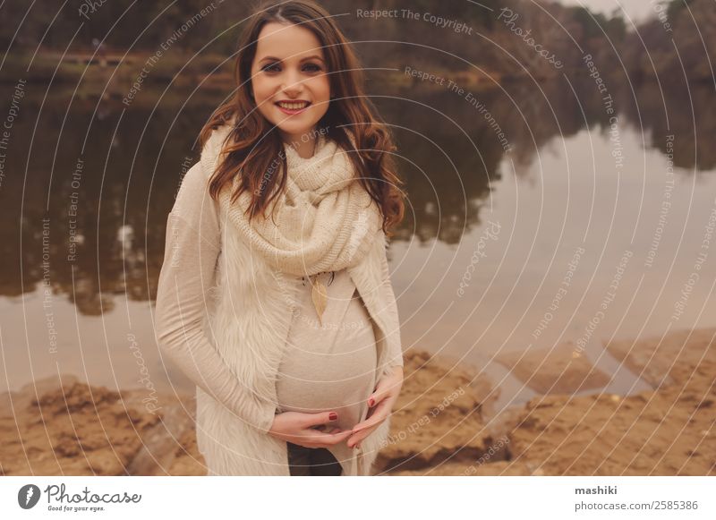 happy pregnant woman walking Lifestyle Joy Feminine Young woman Youth (Young adults) Mother Adults Pregnant Maternity wear Walking Outdoor facilities Smiling