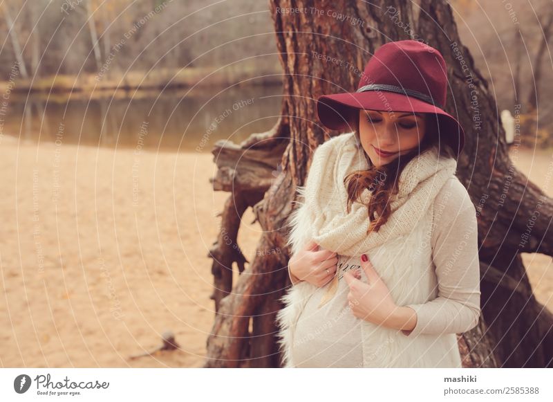 young pregnant woman walking in autumn Lifestyle Beautiful Vacation & Travel Feminine Woman Adults Parents Mother Family & Relations Nature Sand Autumn Tree