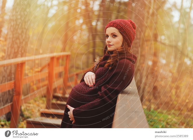 young pregnant woman walking in autumn Lifestyle Happy Beautiful Knit Vacation & Travel Feminine Baby Woman Adults Parents Mother Nature Autumn Bridge Sweater