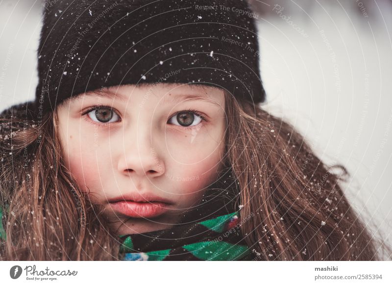 winter portrait of dreamy child girl Beautiful Child Girl Face 8 - 13 years Infancy Winter Weather Snow Snowfall Park Forest Walking Action Delightful Caucasian