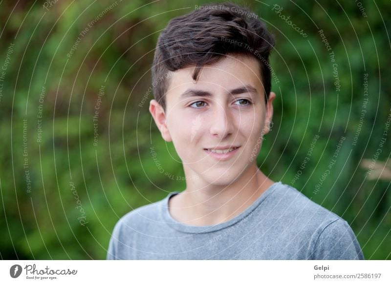 Handsome brown-haired teen Lifestyle Style Happy Face Summer Human being Boy (child) Man Adults Youth (Young adults) Culture Nature Park Fashion Smiling