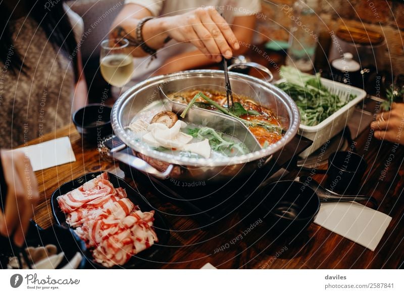 Korean hot pot dish meal at the restaurant Food Meat Seafood Vegetable Soup Stew Eating Pot Lifestyle Vacation & Travel Winter Restaurant Human being Hand 3 Hot