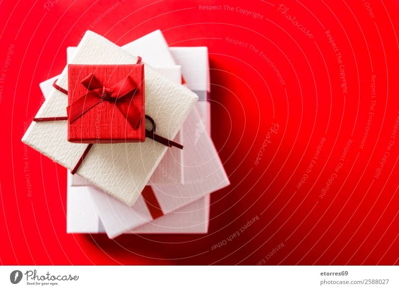 White and red gift boxes on red background. Decoration Feasts & Celebrations Valentine's Day Mother's Day Birthday Box String Red Gift christmas Father's Day