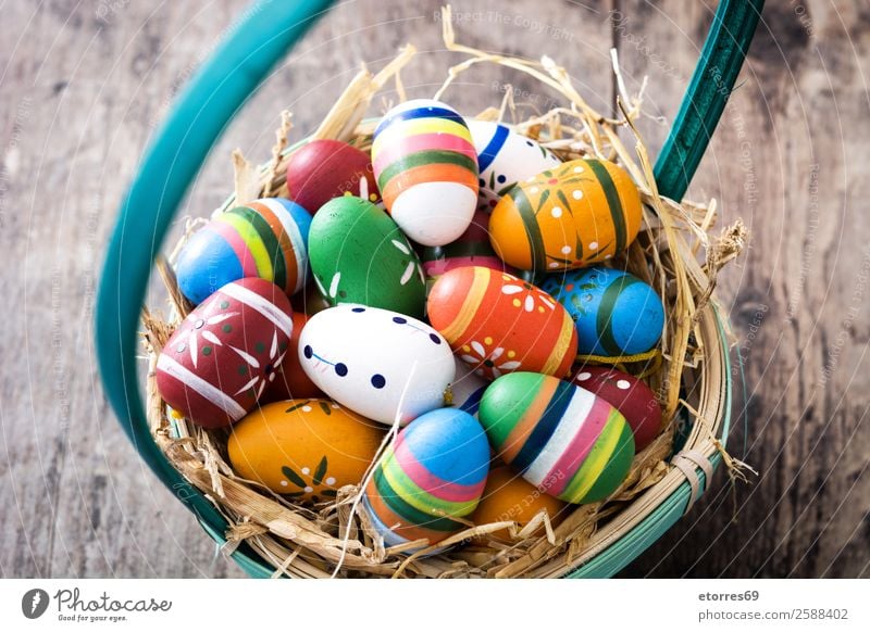 Easter eggs in a basket on wooden background Egg Colour Vacation & Travel Feasts & Celebrations Public Holiday Background picture Guest Decoration Festive Well