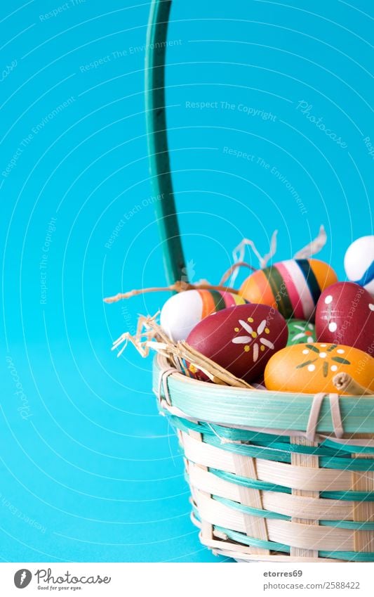 Easter eggs in a basket on blue background Egg Colour Vacation & Travel Feasts & Celebrations Public Holiday Background picture Guest Decoration Festive Well