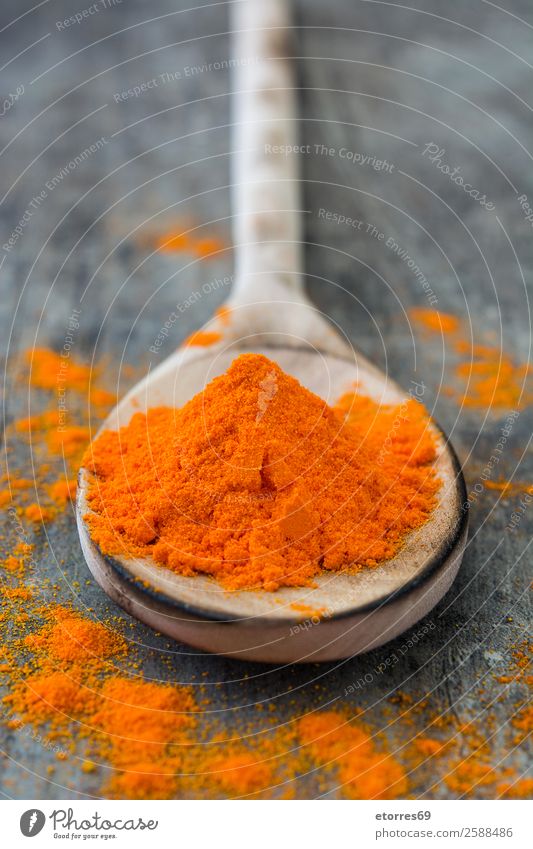 Saffron on a wooden spoon on wooden table Herbs and spices Food Healthy Eating Food photograph Powder Ingredients Orange Spoon Wood Colouring