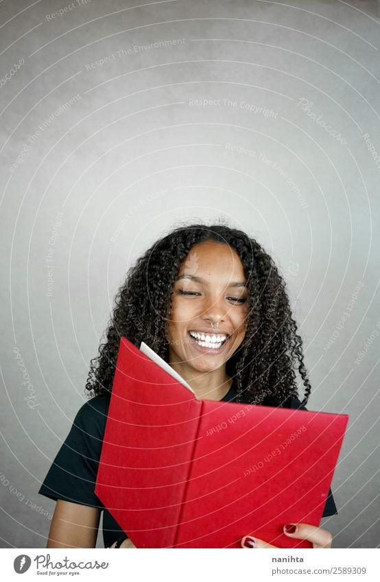 Young happy woman reading a red book Lifestyle Wellness Well-being Contentment Leisure and hobbies Education Study Student Human being Feminine Young woman