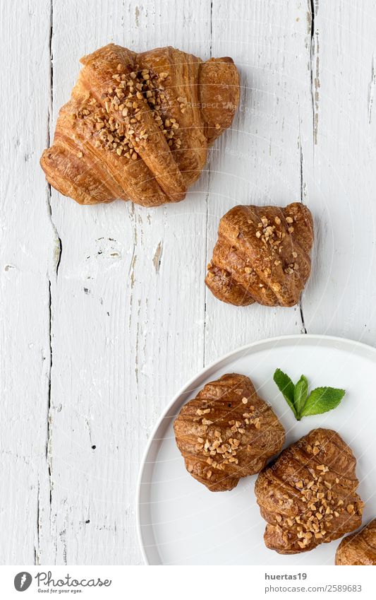 croissant with almonds Food Dessert Plate Fresh Healthy Delicious Above Brown Gold Whistle White Colour photo Detail Deserted Copy Space top Artificial light