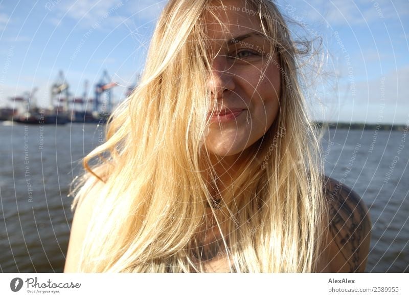 Portrait of a young woman at Hamburg harbour Lifestyle Joy Beautiful Hair and hairstyles Well-being Summer Young woman Youth (Young adults) Face brood
