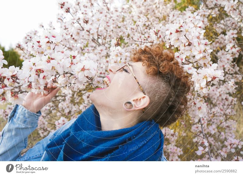Young redhead woman surrounded by flowers Lifestyle Style Joy Happy Beautiful Hair and hairstyles Freedom Human being Feminine Young woman Youth (Young adults)