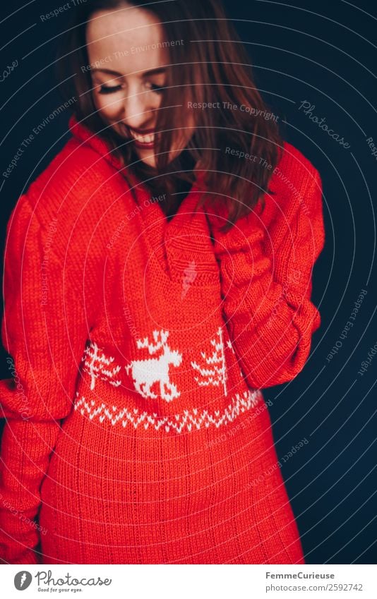 Brunette woman with red deer wool sweater Feminine Woman Adults 1 Human being 18 - 30 years Youth (Young adults) 30 - 45 years Happy Happiness Red Well-being