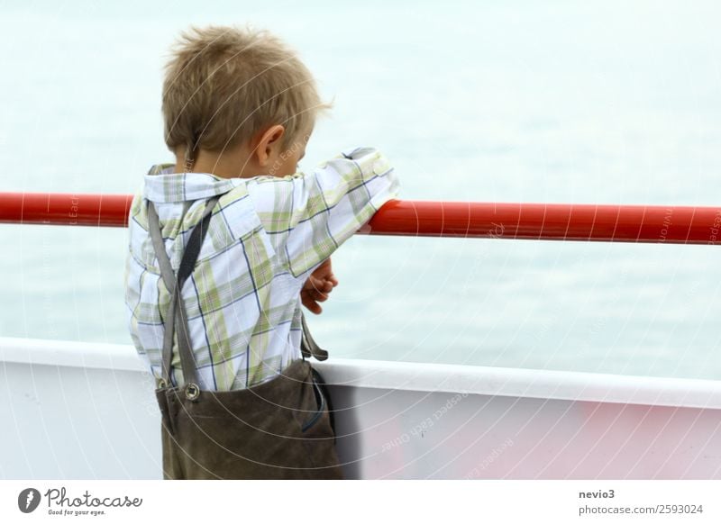 Little boy in leather pants leans on the railing Human being Masculine Child Boy (child) Infancy 1 8 - 13 years Hang Looking Cry Natural Sadness Concern Grief