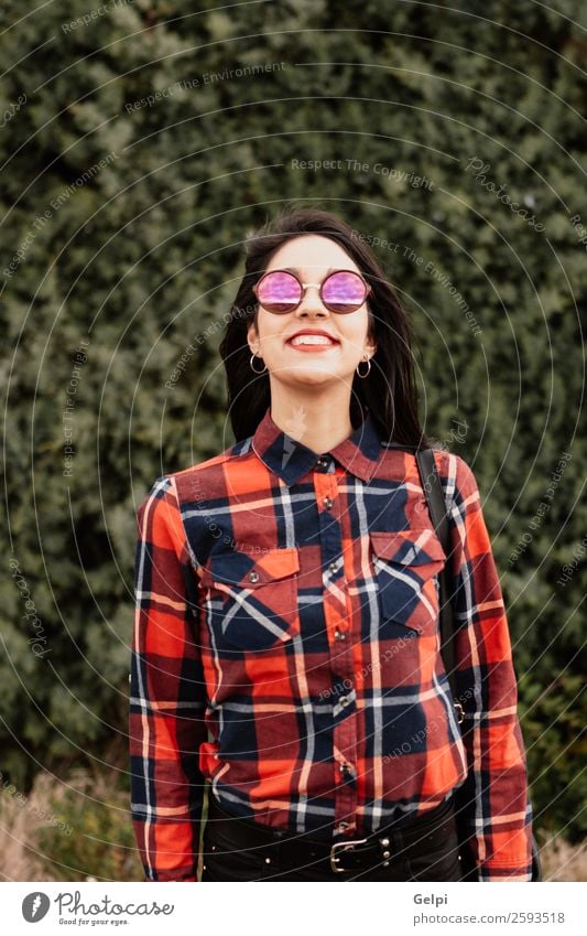 Pretty brunette girl Style Happy Beautiful Face Wellness Human being Woman Adults Lips Nature Flower Park Fashion Jacket Leather Sunglasses Brunette Smiling