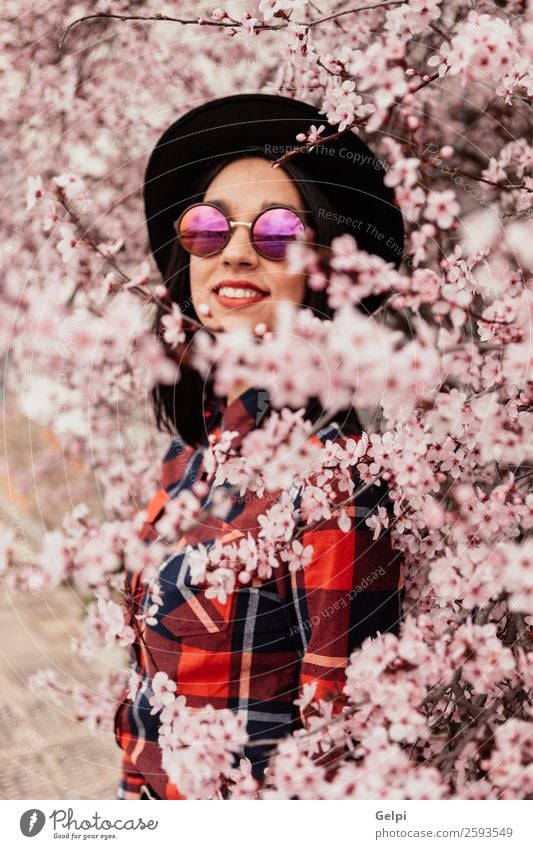 Brunette girl Style Happy Beautiful Face Garden Human being Woman Adults Nature Tree Flower Blossom Park Fashion Sunglasses Hat Smiling Happiness Fresh Long