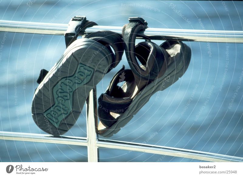 lopsided hangings Footwear Lake Ocean Flip-flops Leisure and hobbies Water Blue railing