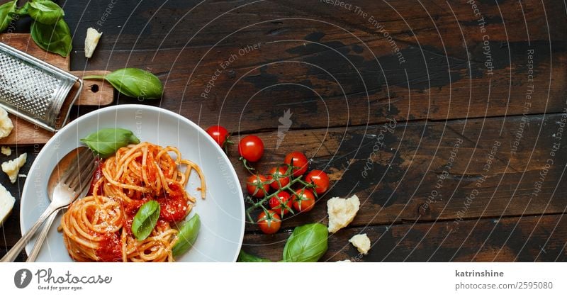 Spaghetti pasta with tomato sauce, basil and cheese Cheese Vegetable Herbs and spices Nutrition Lunch Dinner Vegetarian diet Plate Fork Spoon Restaurant Leaf