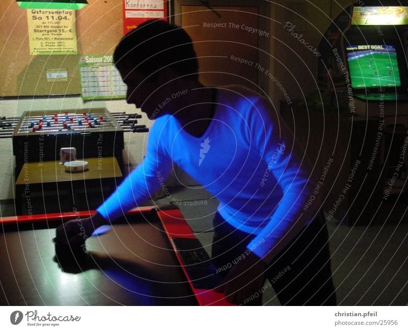 black player Black Playing Darts Amusement arcade Dark Light Man blackish Blue Evening Lighting dim