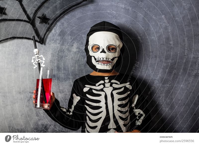 Little kid in a skeleton costume on Halloween Juice Lifestyle Joy Happy Beautiful Face Make-up Leisure and hobbies Entertainment Party Feasts & Celebrations