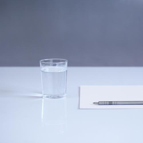 blank Beverage Cold drink Drinking water Glass Stationery Paper Pen Esthetic Simple Modern Blue Gray White Table Colour photo Interior shot Deserted