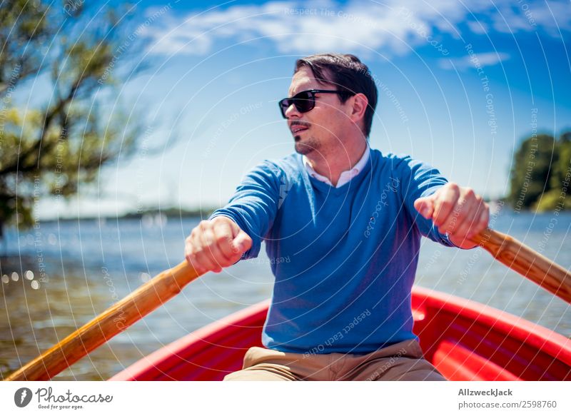 Man rowing in a boat on the lake Day Summer Blue sky Beautiful weather Leisure and hobbies Clouds Lake Watercraft Oar Rowing Portrait photograph Young man
