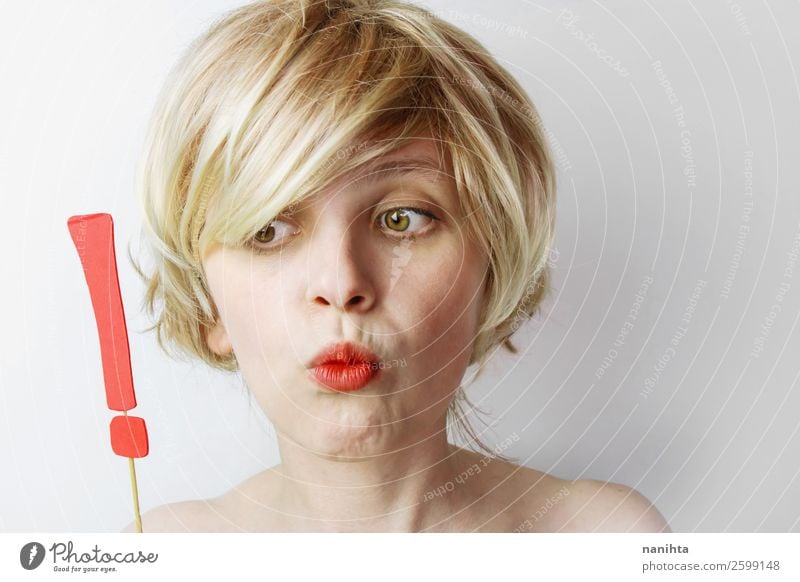Young woman holding an exclamation mark Joy Hair and hairstyles Calm Human being Feminine Youth (Young adults) Woman Adults 1 18 - 30 years Blonde Short-haired