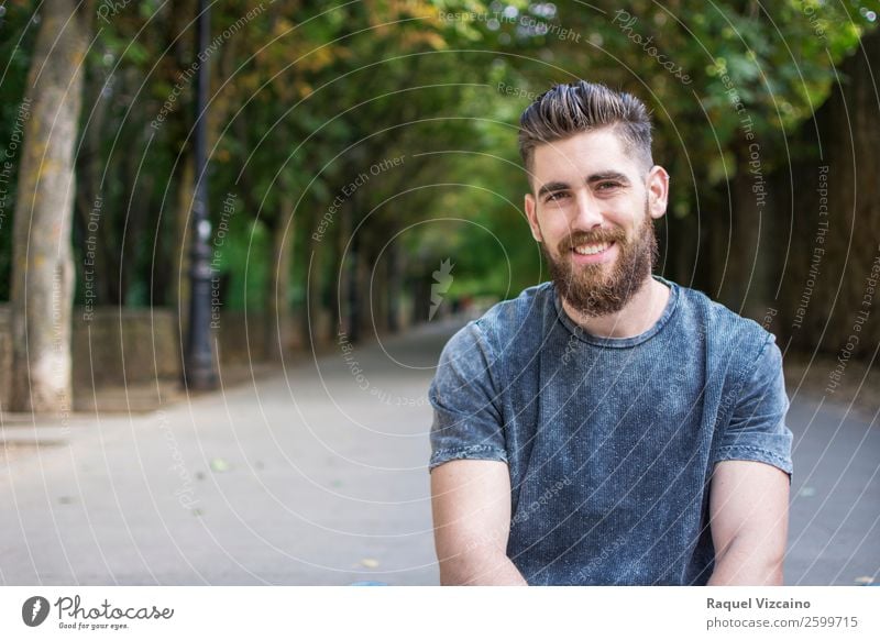 Portrait of a young boy with a beard. Health care Summer Man Adults 1 Human being 18 - 30 years Youth (Young adults) Nature Spring Beautiful weather Tree Park