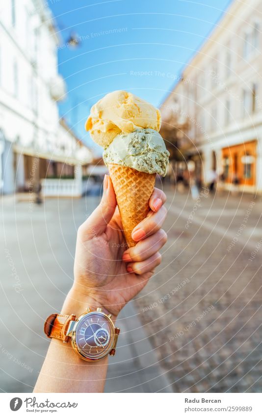 Woman Holding Green And Yellow Ice Cream Cone Food Dairy Products Dessert Ice cream Candy Eating Fast food Lifestyle Style Joy Vacation & Travel City trip