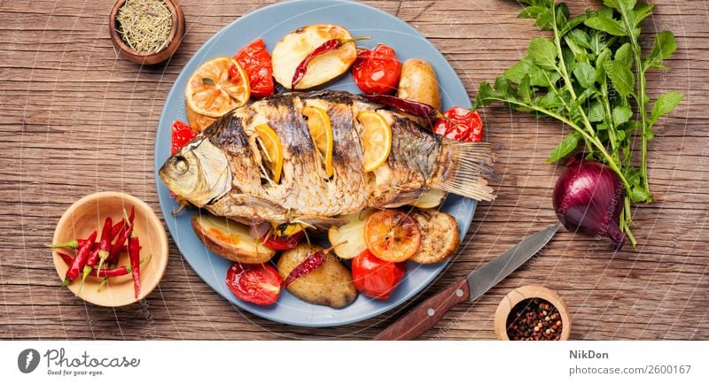 Fish baked with vegetable garnish fish carp meal grilled dinner seafood lemon healthy plate lunch cuisine dish diet roasted parsley flat lay fried paprika