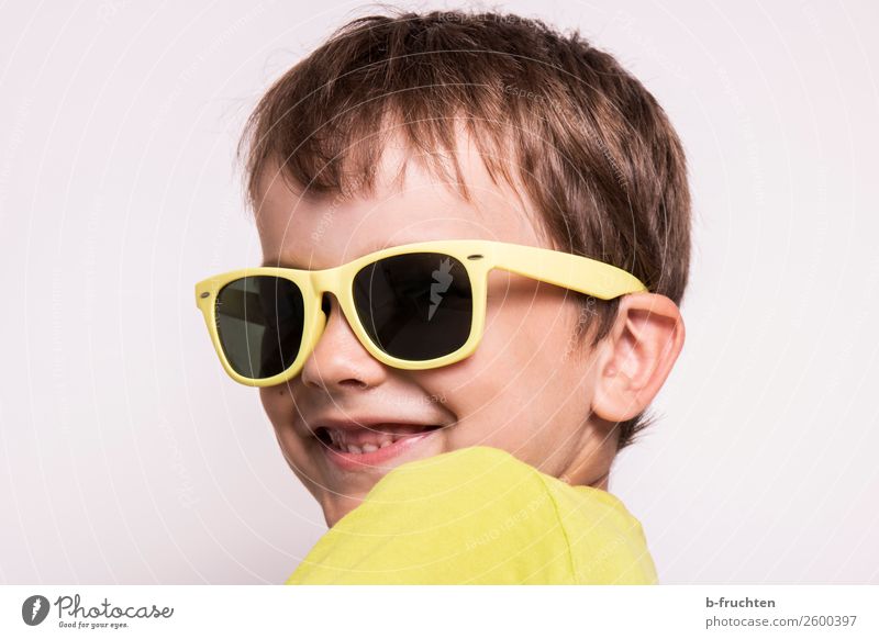 Child with sunglasses Head Face 3 - 8 years Infancy Eyeglasses Sunglasses Observe Smiling Looking Happiness Curiosity Yellow Joy Cool (slang)