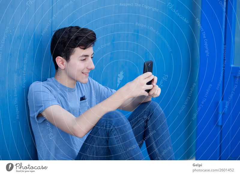Portrait of a teenager Lifestyle Happy Face Playing Music Telephone PDA Technology Human being Boy (child) Man Adults Youth (Young adults) Street Fashion