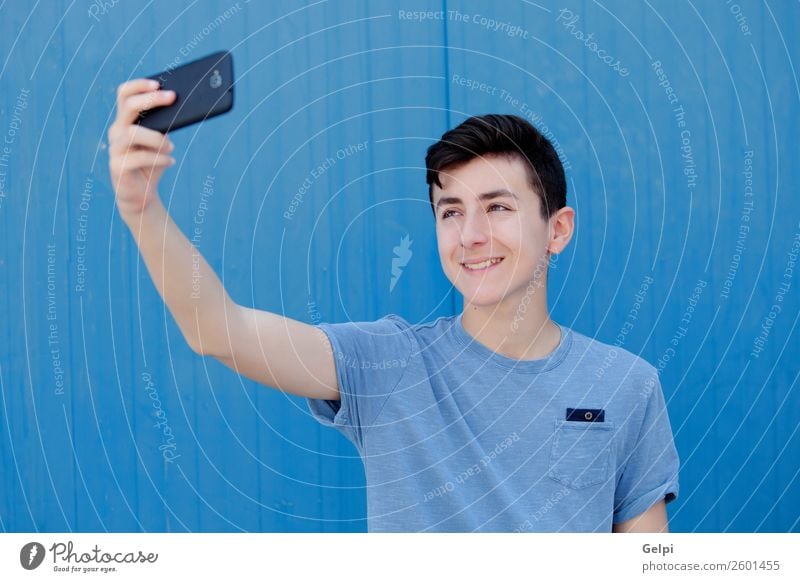 Portrait of a teenager Lifestyle Happy Face Playing Music Telephone PDA Technology Human being Boy (child) Man Adults Youth (Young adults) Street Fashion