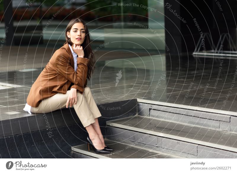 Young businesswoman sitting outside of office building. Happy Beautiful Hair and hairstyles Workplace Office Business Career Human being Feminine Young woman