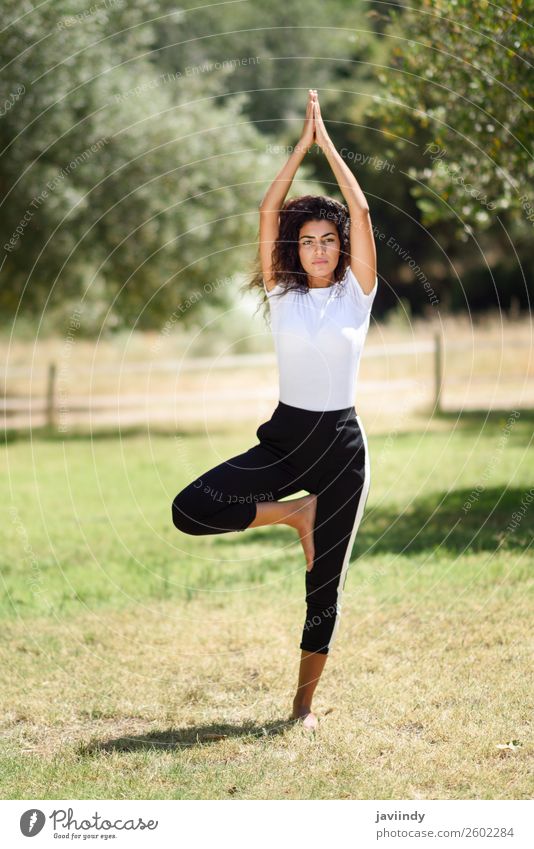 Young Arab woman doing yoga in nature. Lifestyle Beautiful Body Relaxation Calm Meditation Summer Sports Yoga Human being Feminine Young woman