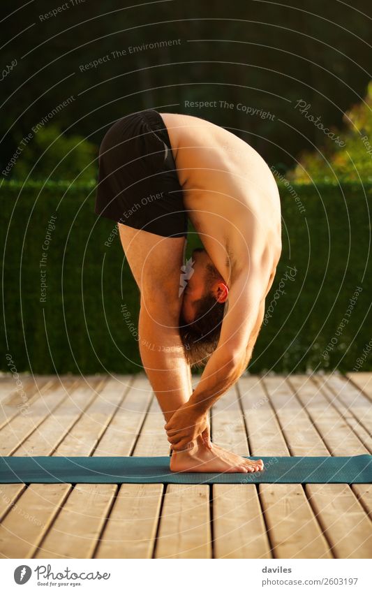 Man doing yoga in nature. Lifestyle Wellness Harmonious Relaxation Calm Leisure and hobbies Summer Yoga Human being Young man Youth (Young adults) Adults Body 1