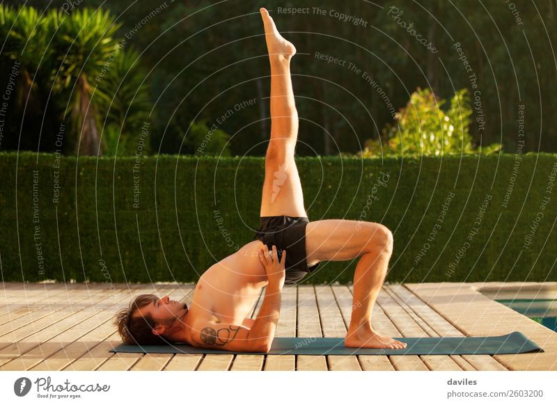Man doing yoga in nature. Lifestyle Wellness Harmonious Relaxation Leisure and hobbies Summer Yoga Human being Adults Body 30 - 45 years Nature Forest Flexible