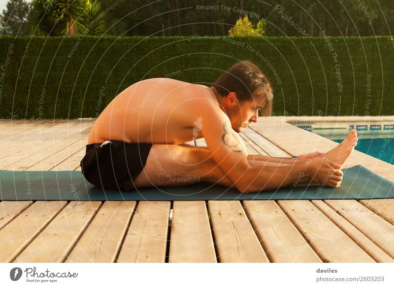 Man doing yoga on the floor Lifestyle Wellness Harmonious Relaxation Calm Meditation Leisure and hobbies Freedom Summer Fitness Sports Training Sportsperson