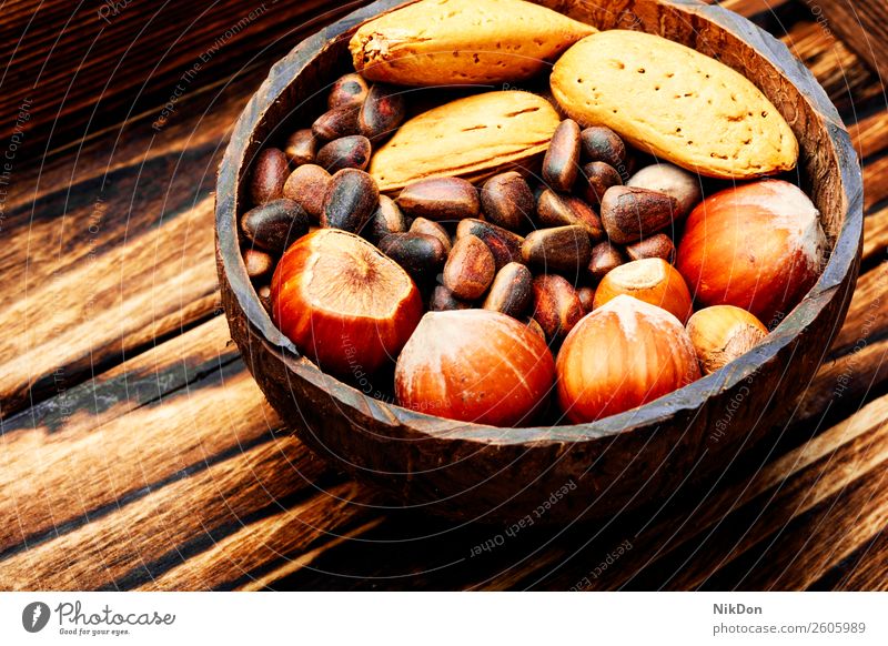 Assorted mixed nuts almond food ingredient hazelnut cashew seed healthy snack vegetarian fruit organic natural closeup brown bowl vegan nutrition raw tasty