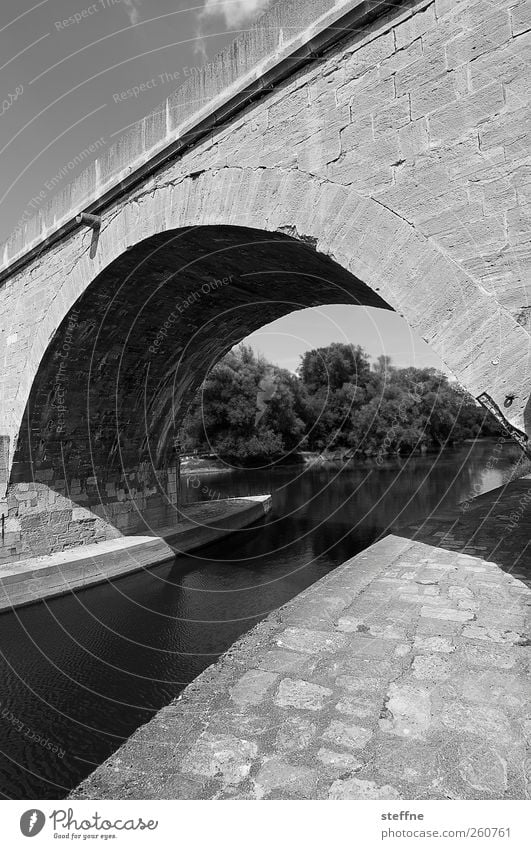 Black and white channel at Adobe Bridge Beautiful weather River Danube Regensburg Old town Tourist Attraction Lanes & trails Stone Strong Robust Defensive Arch