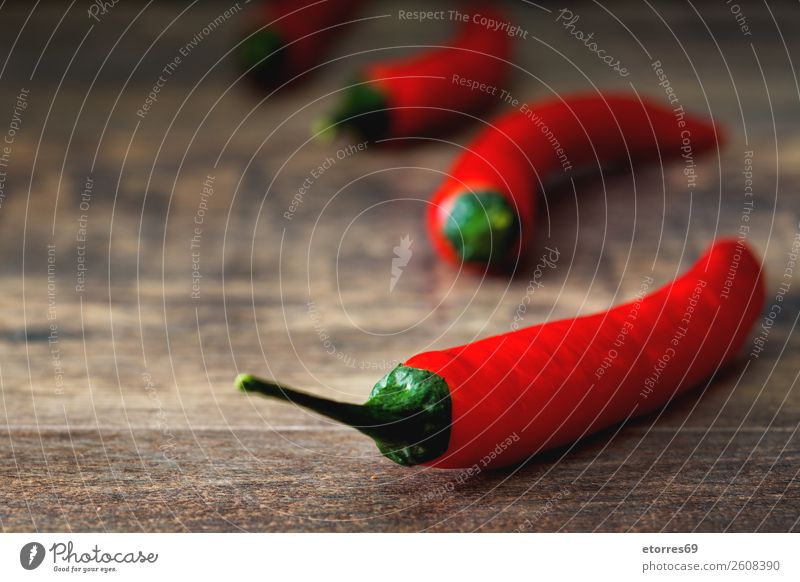 Red chili pepper on wooden table Pepper Chili Spicy Vegetable Food Healthy Eating Food photograph Chile Herbs and spices Burn Cooking Fresh Hot Ingredients
