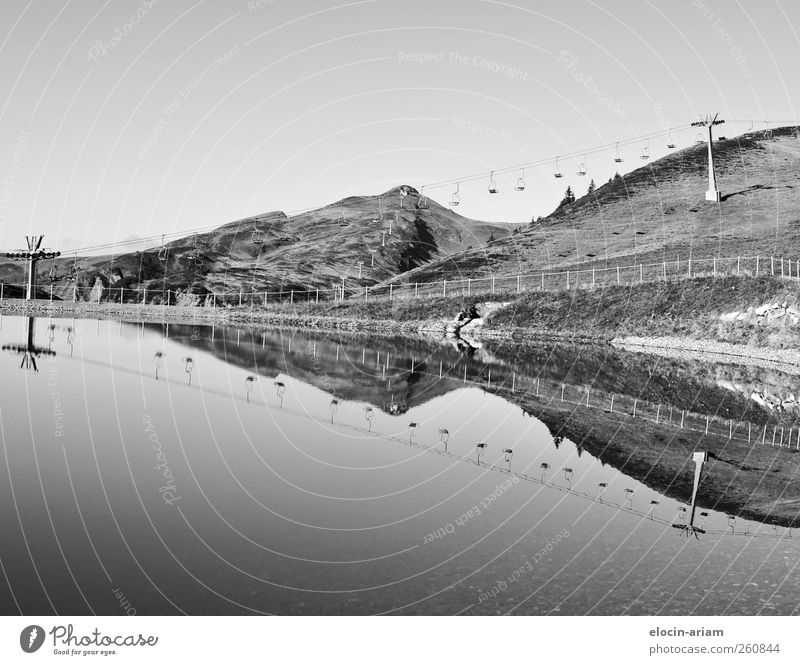 mirroring Environment Nature Landscape Animal Earth Water Meadow Lake Ski lift Discover Idyll Tourism Logistics Far-off places Black & white photo Exterior shot